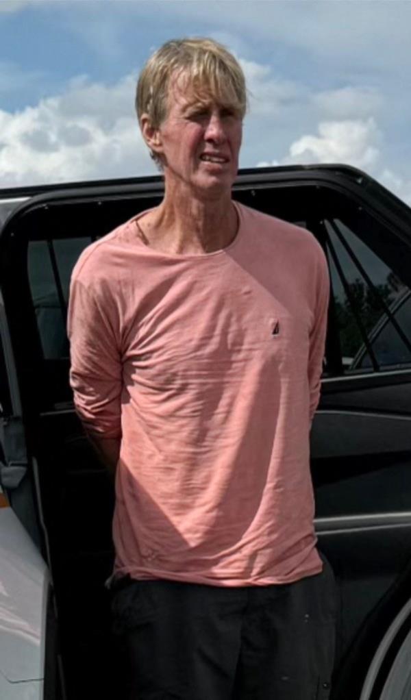 Ryan Wesley Routh, suspect in attempted assassination of Donald Trump, in a pink shirt, following his arrest in Martin County, Florida, 2024.