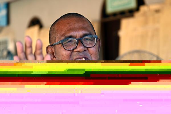 Possessing carpentry skills after decades of being a builder, Omar Mohamed, 68, now spends his time making coffins to be given out for free. — Bernama pic