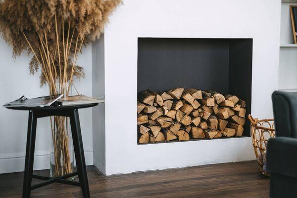 Fill your empty fireplace with cut logs, raw or painted up. Offcuts can also be placed on a backing board to seal the fireplace off when not in use. File picture Fill your empty fireplace with cut logs, raw or painted up. Offcuts can also be placed on a backing board to seal the fireplace off when not in use. File picture